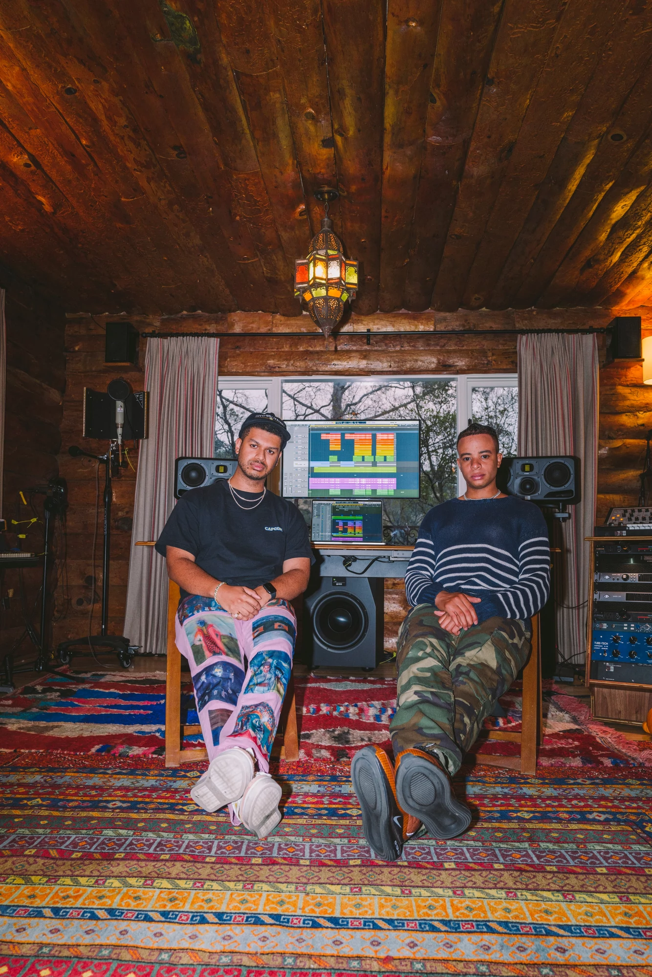 Take A Daytrip sitting with their back to their audio workstation
