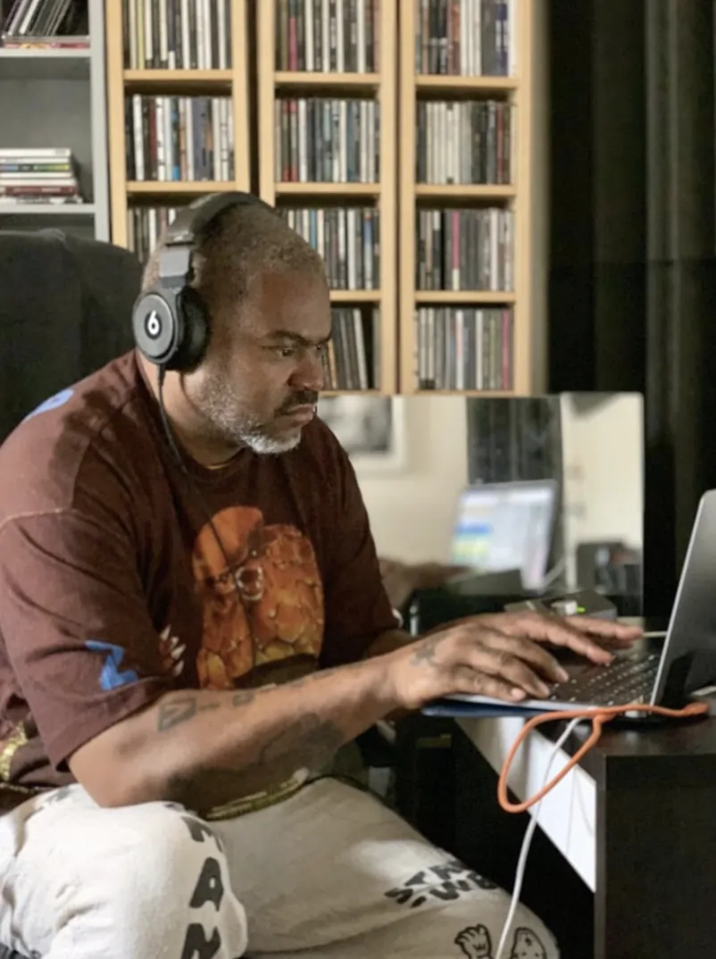 Che Pope sitting in front of a computer