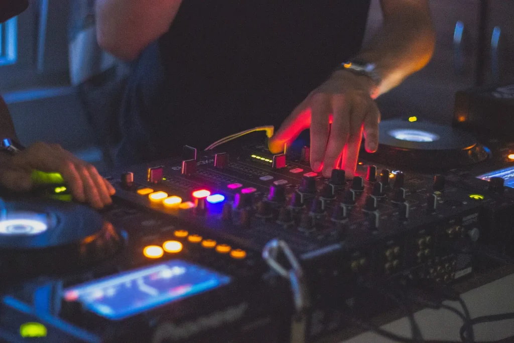 A close up of someone's hand on a mixer
