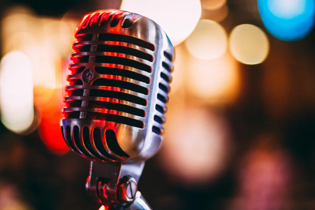 Vintage tube microphone with bokeh light in the background