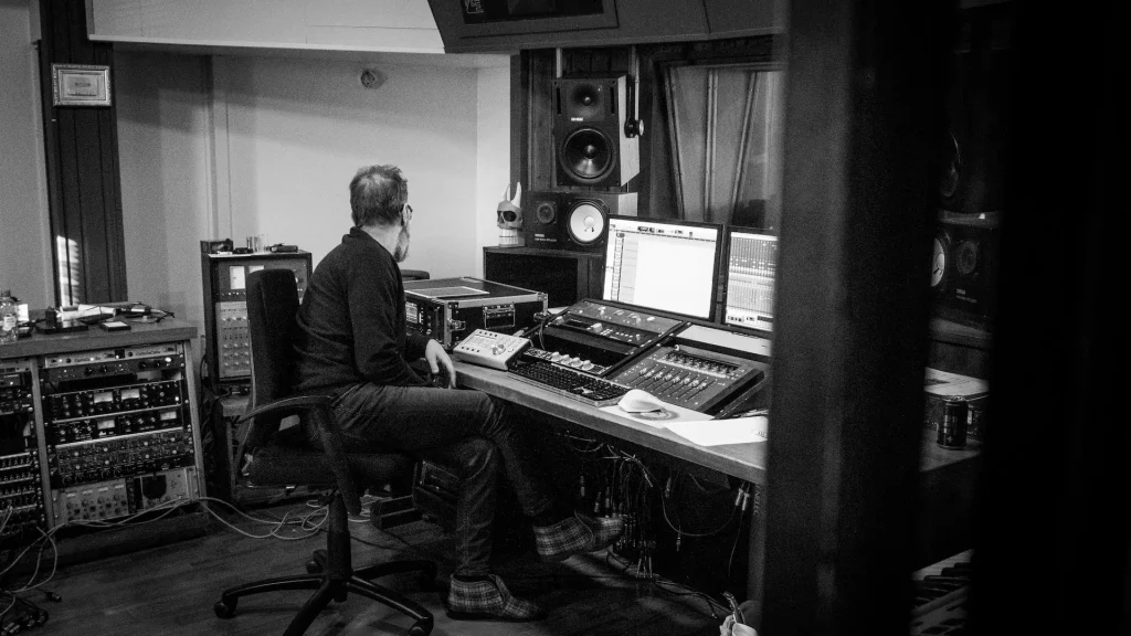 A man sitting in a recording studio